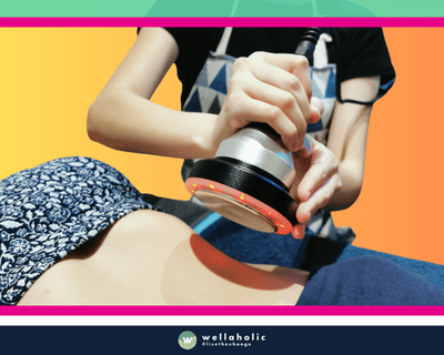 In the bustling city-state of Singapore, a woman is availing the innovative WellaCavi Ultrasonic Fat Cavitation treatment at Wellaholic. Wellaholic’s WellaCavi uses ultrasound fat cavitation to break apart the fat deposits in your body. Also known as ultrasonic lipolysis, this body contouring treatment is also known by other names such as Ultrashape or Liponix. WellaCavi is a much safer alternative to surgical options, such as liposuction. This cavitation treatment is most ideal for targeting small areas of fat to help you contour and sculpt your body. The efficacy of the WellaCavi Ultrasonic Fat Cavitation treatment is well-documented. Numerous customers have reported noticeable changes after just a handful of sessions, making it a sought-after choice for those in pursuit of a safe and effective body sculpting technique. The woman undergoing the treatment is under the care of Wellaholic’s highly trained staff. Their proficiency and commitment to customer satisfaction ensure a positive and relaxing experience throughout the treatment process.