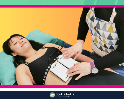 In the bustling city-state of Singapore, a woman is availing the innovative WellaLipo laser lipo slimming treatment at Wellaholic. WellaLipo™= laser lipo laser slimming treatment is a non-invasive, non-surgical procedure which uses low-wave laser energy to eliminate fat from your body effectively with no downtime. WellaLipo uses lasers to shrink the fat cells instead of removing or destroying them. The fat cells absorb the laser light energy, which causes the fat to escape from the fat cell membrane. The efficacy of the WellaLipo laser lipo slimming treatment is well-documented. Numerous customers have reported noticeable changes after just a handful of sessions, making it a sought-after choice for those in pursuit of a safe and effective body sculpting technique. The woman undergoing the treatment is under the care of Wellaholic’s highly trained staff. Their proficiency and commitment to customer satisfaction ensure a positive and relaxing experience throughout the treatment process.