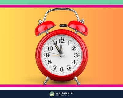 Red clock with Wellaholic logo