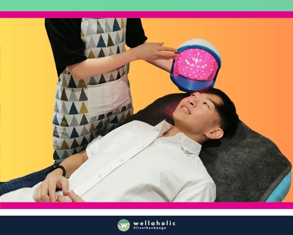 In the bustling city-state of Singapore, a male customer is experiencing the innovative Low-Level Laser Therapy (LLLT) treatment at Wellaholic. This advanced treatment is designed to help individuals achieve their hair health goals by using low-level laser light to stimulate hair follicles and promote hair growth. The LLLT treatment is a non-invasive procedure that uses low-level laser light to target hair follicles, stimulating cellular activity and promoting hair growth. This process results in thicker, healthier, and more robust hair, enhancing the individual’s overall appearance. The effectiveness of the LLLT treatment is widely recognized. Many customers have reported visible improvements in their hair thickness and health after just a few sessions, making it a popular choice for those seeking a safe and effective hair health treatment. The male customer undergoing the treatment is in the capable hands of Wellaholic’s professional staff. Their expertise and dedication to customer satisfaction ensure a positive and comfortable experience throughout the treatment process.